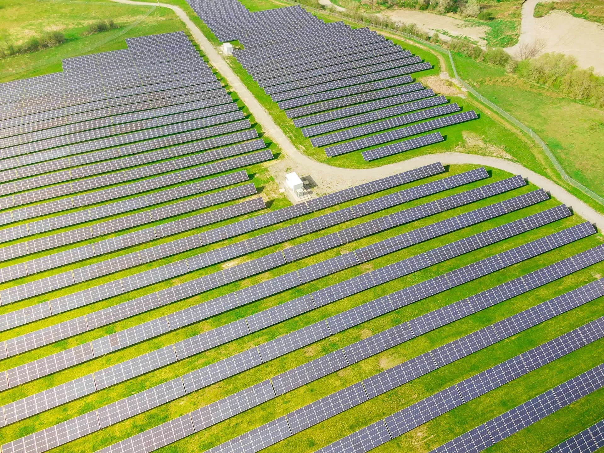 Wind turbines and solar panels as part of renewable energy adoption